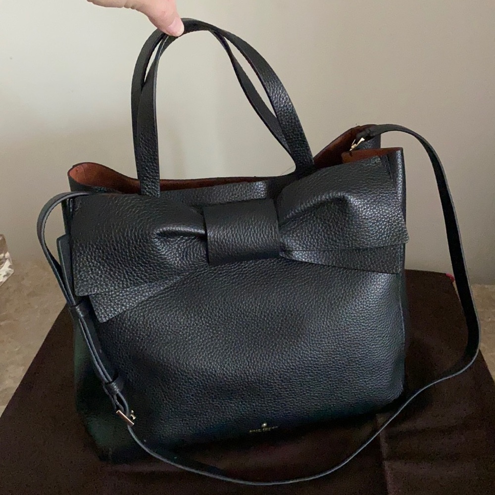 Kate Spade purse with large bow accent.